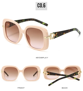 Detail view of square nude frame sunglasses with tortoise temples and gold metal accents