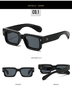 Detail view of black square frame sunglasses with golden three-point metal rivets