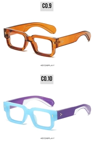 Detail view of square frame sunglasses in amber and blue colors with metallic floral studs