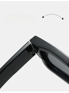 Detail shot of durable metal hinge on black square frame sunglasses with glossy finish