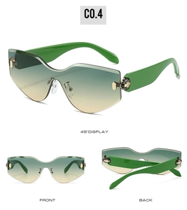 Detail view showing snake head hinge ornament and green gradient rimless lens of sunglasses