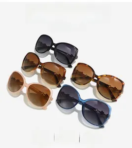 Detail of five oversized clover sunglasses in multiple colors with floral metal accents
