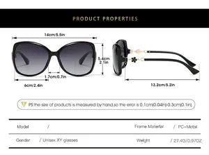 Detailed size chart for oversized polarized sunglasses with floral temple accents