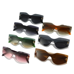 Collection of oversized rimless serpent head sunglasses with gradient lenses and gold accents