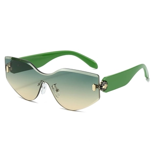 Frameless sunglasses with gradient lenses and green temples featuring gold snake head detail