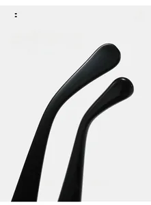 Macro detail of curved black square sunglasses temple with premium polished finish