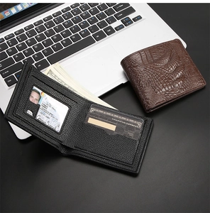 Close-up of crocodile textured men's wallet showing internal card slots and compartments