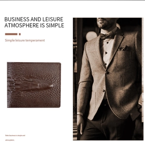 Detail of dark brown men's wallet with crocodile texture and professional business layout