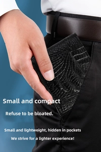 Slim men's crocodile texture wallet being placed easily into a trouser pocket