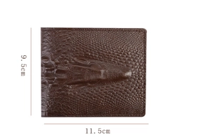 Macro view of horizontal men's bifold wallet with deep brown crocodile leather texture