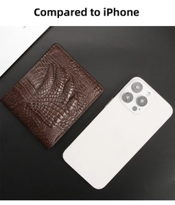 Short brown crocodile leather wallet compared to an iPhone for size reference