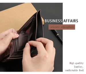 Detail view of leather wallet interior with cash slots and a secure metal zipper pocket