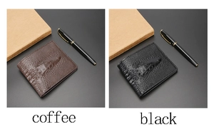 Detail of embossed crocodile pattern on coffee and black men's leather wallets