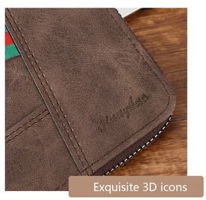 Macro shot of brown pebble-textured leather wallet with red-green stripe and zipper