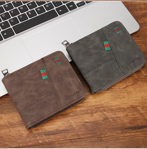 Close-up of brown and grey men's zip wallets featuring textured finish and stripe detail