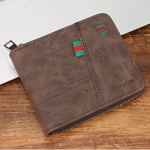 Macro shot of brown retro PU leather wallet with zipper closure and striped webbing detail