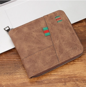 Detailed macro view of vintage brown leather men's wallet with red-green striped ribbon