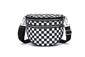 Detail of checkered crossbody bag showing dual silver zippers and durable fabric texture