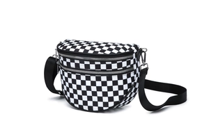 Detail of checkered crossbody bag with double silver zippers and adjustable strap