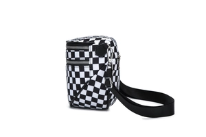 Side view of checkered crossbody bag showing silver zippers and nylon strap