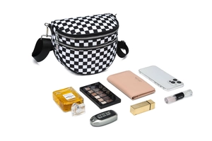 Detail view of checkerboard crossbody bag with multi-compartments for everyday essentials