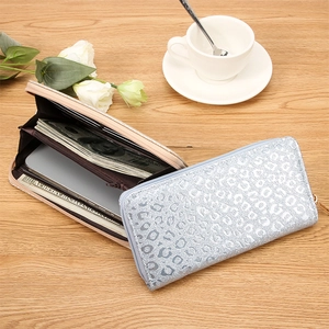 Detail view of large capacity leopard print wallet showing card slots and phone storage