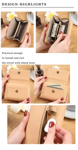 Detail view of beige multi-slot accordion card holder with zipper coin pocket and magnetic closure