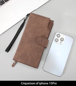 Size comparison of a long brown pebble leather wallet next to an iPhone 15 Pro