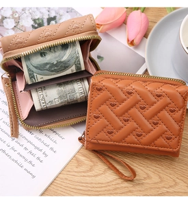 Detailed view of mini wallets with heart embroidery and multi-slot interior organization