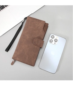 Detail of coffee brown long wallet with matte leather finish and magnetic clasp closure