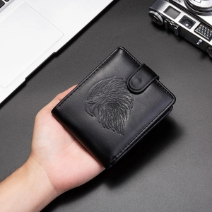 Close-up of black PU leather wallet featuring an embossed eagle head and snap closure