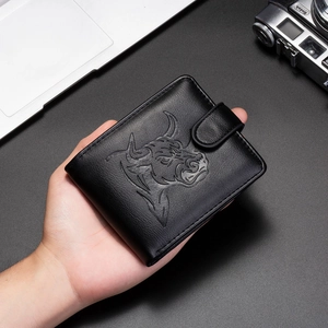 Premium black leather men's wallet with bull head embossing and snap closure in a hand-held shot