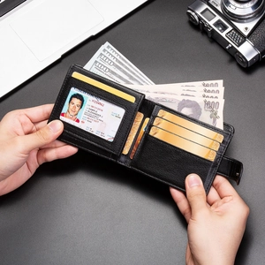 Detail of black leather wallet interior featuring multiple card slots and ID window