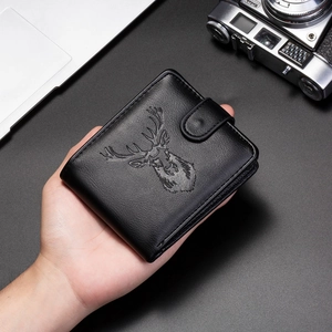 Close-up of black PU leather wallet featuring embossed stag head design and snap closure