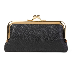 Retro black lychee leather kiss-lock coin purse with golden metal frame on white background
