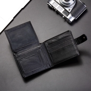Men's black leather wallet with embossed lion head and multiple card slots in a business style