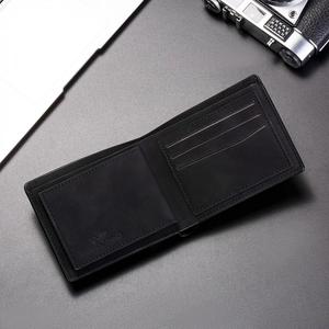 Macro shot of bifold wallet interior showing card slots and matte leather texture