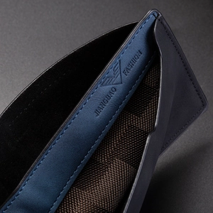 Macro shot of men's wallet interior with blue leather trim and checkered fabric lining