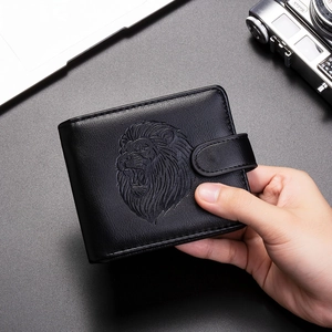 Men's vintage black leather wallet featuring embossed lion head and secure buckle strap