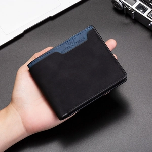 Close-up of matte two-tone bifold leather wallet held in hand for business use