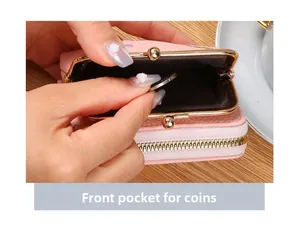Pink faux leather coin purse featuring a gold kiss-lock front pocket and zipper closure
