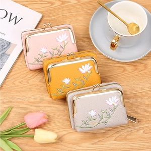 Detailed embroidery of lotus on stylish faux leather kiss-lock mini coin purses