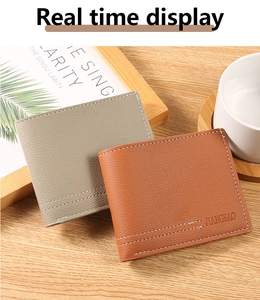 Close-up of litchi grain leather wallets in grey and brown with detailed white stitching
