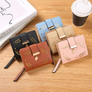 Short PU leather wallets for women in five colors with hollow leaf pendant detail