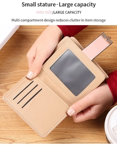 Interior detail of a compact khaki leather wallet featuring card slots and ID window