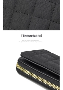 Détail de la texture en cuir noir matelassé avec losanges et fermeture éclair dorée