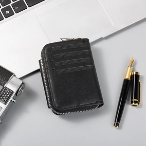 Men's black leather card holder with zip closure and parallel embossed lines detail
