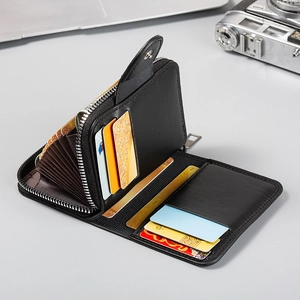 Close-up of black leather organizer wallet showing zipper compartment and multi-card slots