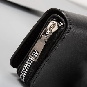 Close-up of premium black leather wallet with smooth silver metal zipper detailing