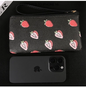 Litchi texture black pouch with strawberry prints next to an iPhone for size comparison